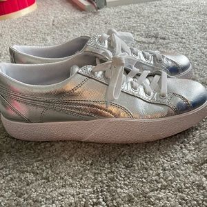 Silver Puma tennis shoes. Never worn